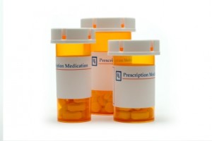 Three prescription drug bottles that can lead to prescription drug abuse.